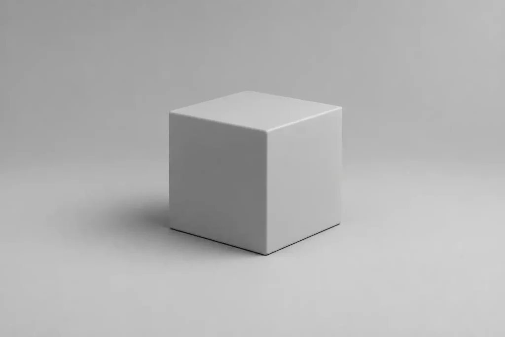 Minimal clay cube centered on soft gray background